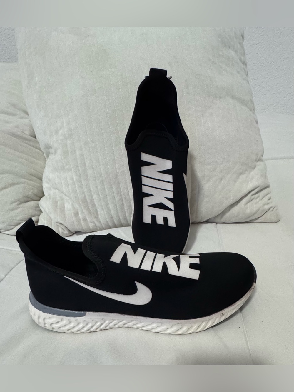 Nike Women’s Slip-On Sneakers in Black and White
